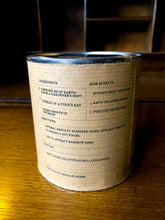 Load image into Gallery viewer, Image of a tin of Fourth Leaf of Clover with kraft paper label showing the faux ingredients and side effects on the back