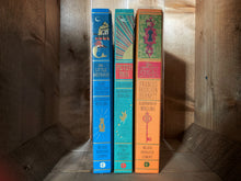 Load image into Gallery viewer, Image showing three of the MinaLima edition books including The Little Mermaid, Peter Pan and The Secret Garden.