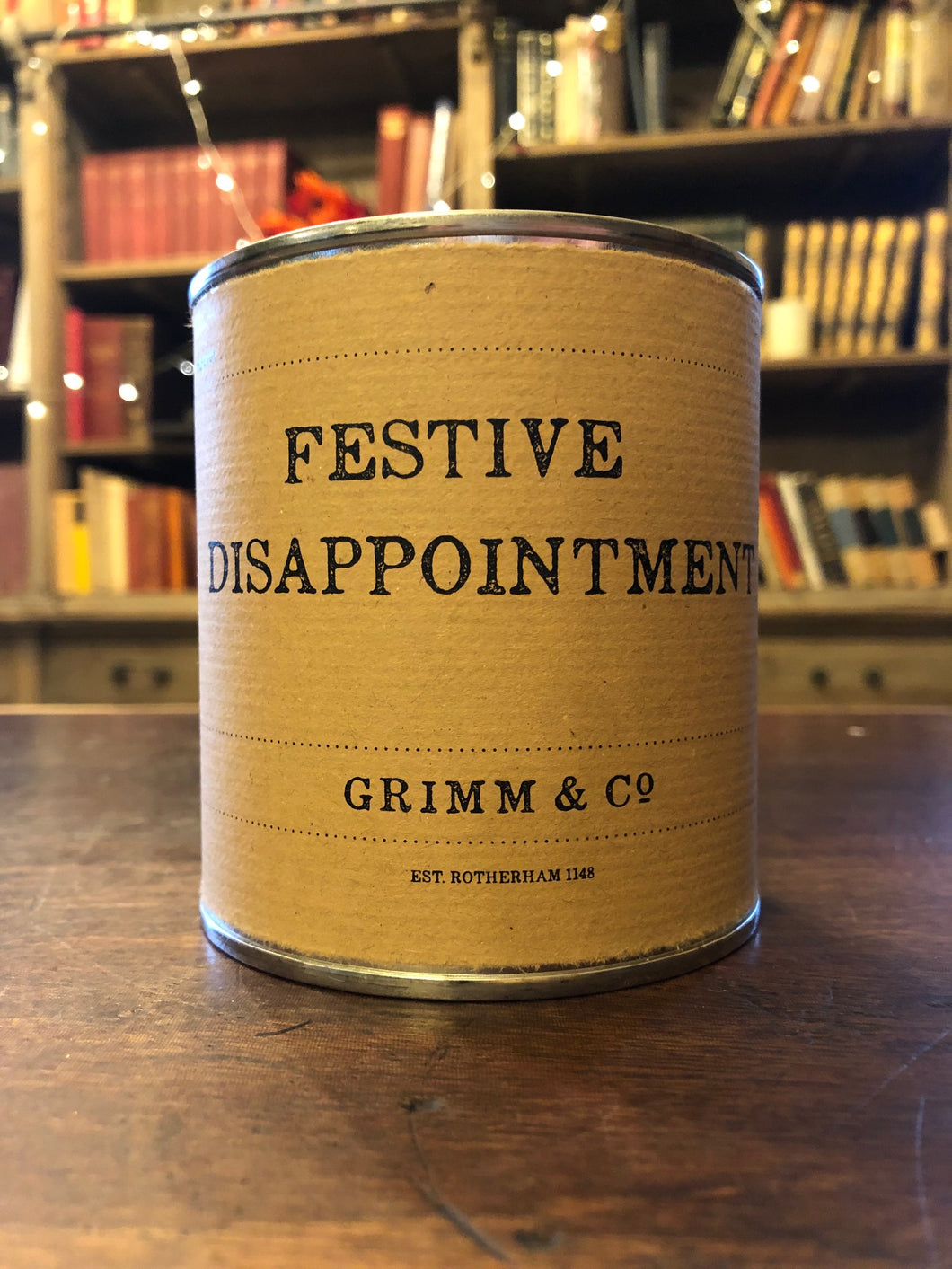Image shows a tin of Festive Disappointment with kraft paper label