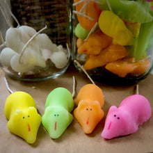 Load image into Gallery viewer, Image showing yellow, green, orange and pink crystallized sugar mice sat on kraft paper with glass jars filled of sugar mice in the background.