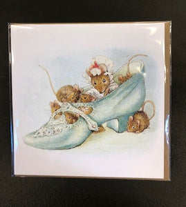 Image showing the greetings card of Mice in a Shoe taken from an illustration by Beatrix Potter. Full-colour print shows a family of mice sat inside a light blue shoe with a kraft brown envelope.