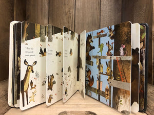 Image of the board book Everybody's Welcome by Patricia Hegarty with cut-outs, different page widths  and stylized woodland animals illustrated by Greg Abbott.