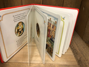 Image of Peepo! board book with pages fanned open to show some illustrations and cut outs from each page.