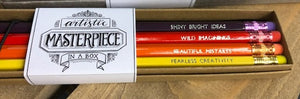 Image shows the Artistic Masterpiece in a Box set of Word Wands in sunset shades of yellow, orange, red and purple. Slogans at end near erasers printed in silver ink and read, Fearless Creativity, Beautiful Mistakes, Wild Imaginings, Shiny Bright Ideas.