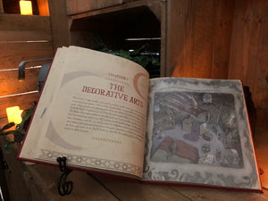 Image of The Book Of Wizard Craft laying open, showing the first page of Chapter 2 and an illustration.