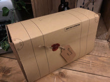 Load image into Gallery viewer, Image shows the wrapped Gift Box to Mull Over, presented as it would be delivered, ready to unwrap. Box resembles a suitcase design with a red wax seal attaching the tag.