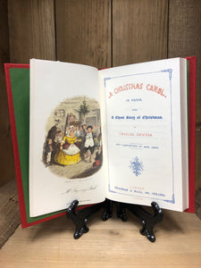 Image shows a colour plate illustration and title page from A Christmas Carol hardback book. Illustration shows Mr & Mrs Fezziwig dancing at the ball.