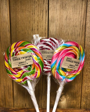 Load image into Gallery viewer, Image shows a cluster of three hard Tongue Twister spiral lollipops in a variety of colours.