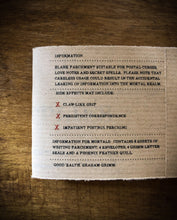 Load image into Gallery viewer, Detail image of the kraft label showing the faux side-effects and warnings for mortals.