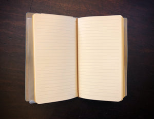 Image of an open journal showing the refillable lined insert.