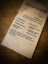 Load image into Gallery viewer, Image of close up of Motivation kraft paper label detailing the faux ingredients and side effects for humans.