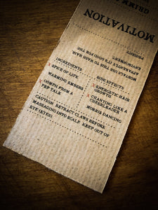 Image of close up of Motivation kraft paper label detailing the faux ingredients and side effects for humans.