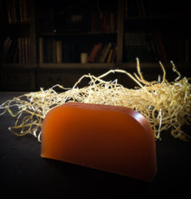 Load image into Gallery viewer, Image of a slice of Motivation potion, otherwise known as ginger scented solid shampoo bar shown without the kraft paper label.