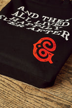 Load image into Gallery viewer, Close up image of the white printed slogan &#39;And they all lived happily ever after&#39; with the red printed Grimm &amp; Co &#39;G&#39; monogram in the bottom right corner of the tote bag