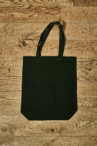 Image of back view of black cotton tote book bag