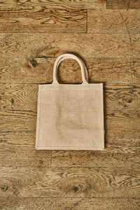 Image of the back of a jute tote bag