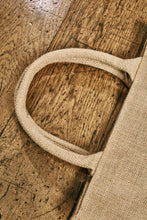 Load image into Gallery viewer, Close up image of the jute tote bag handles