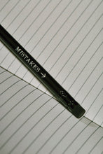 Load image into Gallery viewer, Close up details of lettering on a Word Wand, otherwise known as a black pencil with a black eraser at the top. The silver lettering in the image  reads &#39;Mistakes&#39; with an arrow pointing towards the eraser.