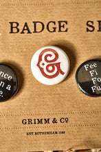 Load image into Gallery viewer, Image of a white button badge with the Grimm &amp; Co red &#39;G&#39; monogram on the front