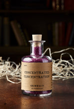 Load image into Gallery viewer, Image of Concentrated Concentration, otherwise known as scented, purple bath salts in a glass bottle with cork 