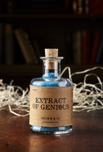 Load image into Gallery viewer, Image of Extract of Genius, otherwise known as scented, blue bath salts in a glass bottle with cork. On this label the spelling of the word Genius is deliberately misspelled to &#39;Genious&#39; with the &#39;o&#39; crossed out