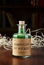 Load image into Gallery viewer, Image of Compound of Wicked, otherwise known as scented, green bath salts in a glass bottle with cork 