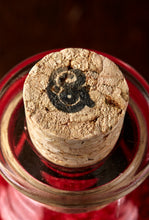 Load image into Gallery viewer, Detail image of the &#39;G&#39; stamped cork on the bottle of Middle Aged Vitriol