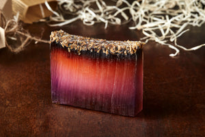 Image of 99% Phoenix Ash, otherwise known as lavender soap with lavender on top, shown without kraft label.