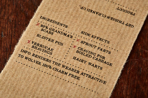 Image shows kraft paper label for Grandma's Scabs solid potion ingredient, a pink rose scented soap slice. Label lists the faux ingredients and side effects.