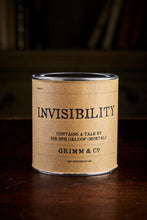 Load image into Gallery viewer, Image of a tin of Invisibility. A silver tin wrapped in a kraft paper label