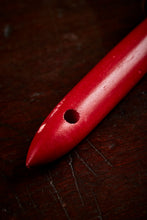 Load image into Gallery viewer, Close up image of the red wooden handle on the Brain Duster, otherwise known as a feather duster, with hole in handle end for hanging 