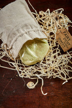 Load image into Gallery viewer, Image of a linen drawstring pouch labelled Edible Fairy Dust with a kraft paper label. Pouch is open to reveal bag inside containing coloured sherbet