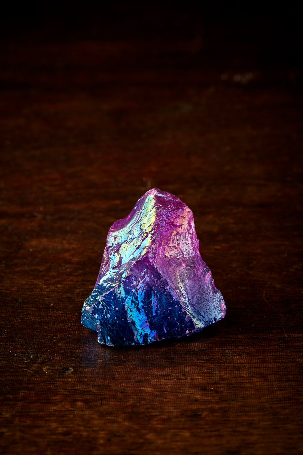 Image of a blue Fire Rock, otherwise known as quartz stones plated in different metals to provide a rainbow sheen
