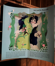 Load image into Gallery viewer, A close up image of one of the cut-out carousel scenes showing the tale of Peter Pan. 