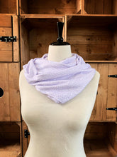 Load image into Gallery viewer, Image of the story excerpt infinity scarf featuring text from Alice&#39;s Adventures in Wonderland written by Lewis Carroll. Scarf is white with lilac cursive text. Scarf is shown on a mannequin.