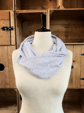 Load image into Gallery viewer, Image of the story excerpt infinity scarf featuring text from The Adventures of Sherlock Holmes written by Sir Arthur Conan Doyle. Scarf is white with grey cursive text. Scarf is shown on a mannequin.