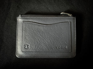 Image shows the back of the blue Yoshi leather zip coin purse with a back slip pocket in plain blue leather, embossed with Yoshi branding.