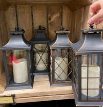 Load image into Gallery viewer, Image showing all four styles of Bright Ideas Lanterns in both bronze and black colours. Styles include plain windows, large X lattice, small X lattice and square lattice patterns.