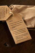 Load image into Gallery viewer, Closeup image of the Salt of Serenity label, displaying faux ingredients and side effects.