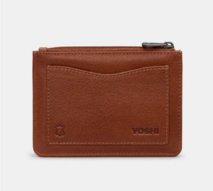 Image shows the back of the brown Yoshi leather zip top coin purse with back slip pocket and embossed YOSHI and genuine leather stamps on the bottom of the pocket.