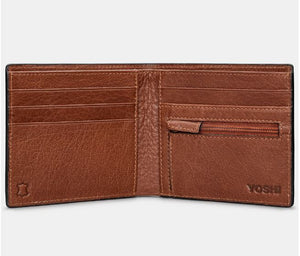 Image shows the inside of the brown Yoshi leather Shakespeare wallet with six card slots, a zip coin pocket, two behind-card slip pouches and the notes pouch at the back. Outer inside corners are embossed with YOSHI and the genuine leather symbol.