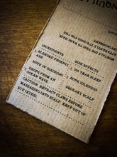 Load image into Gallery viewer, Close up of Tranquility kraft paper label showing faux ingredients and side effects