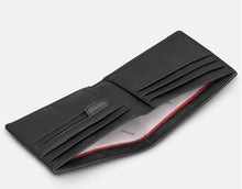Load image into Gallery viewer, Image shows the black Yoshi vegan leather classic bookworm wallet pictured open to reveal the notes section across the length of the wallet, and two sides with card slots and zip coin pocket. Lining of wallet is white printed with grey YOSHI text. Zip pocket is embossed with YOSHI.