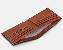 Load image into Gallery viewer, Image shows the brown Yoshi vegan leather classic bookworm wallet pictured open to reveal the notes section across the length of the wallet, and two sides with card slots and zip coin pocket. Lining of wallet is white printed with grey YOSHI text. Zip pocket is embossed with YOSHI.