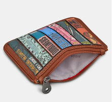 Load image into Gallery viewer, Image shows the brown vegan leather zip top purse opened to reveal the white lining printed with grey YOSHI text.