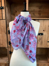 Load image into Gallery viewer, Image of the story extract scarf &#39;Extract from a tale under the sea&#39; with a printed pattern of rockpool plants and creatures such as seaweed and crabs in purples and pinks. Scarf displayed tied around a mannequin.