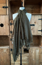 Load image into Gallery viewer, Image of a loosely woven, moss green unisex scarf with tassels along the bottom edges. Scarf is shown wrapped around a mannequin.
