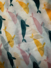 Load image into Gallery viewer, Image of the story extract scarf &#39;Extract from tales with whales&#39; with a printed repeating pattern of yellow, teal and pale pink whales on a white background. Image shows detail of full printed pattern.
