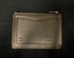 Image shows the back of the Yoshi leather coin keeper for the Sci-Fi design. Leather is black and features a back slip pocket and a zipper across the top. 