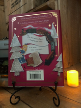 Load image into Gallery viewer, mage of the back of the hardback book Pages &amp; Co: Tilly and the Map of Stories written by Anna James and illustrated by Paola Escobar. Displayed on a book stand with candles.